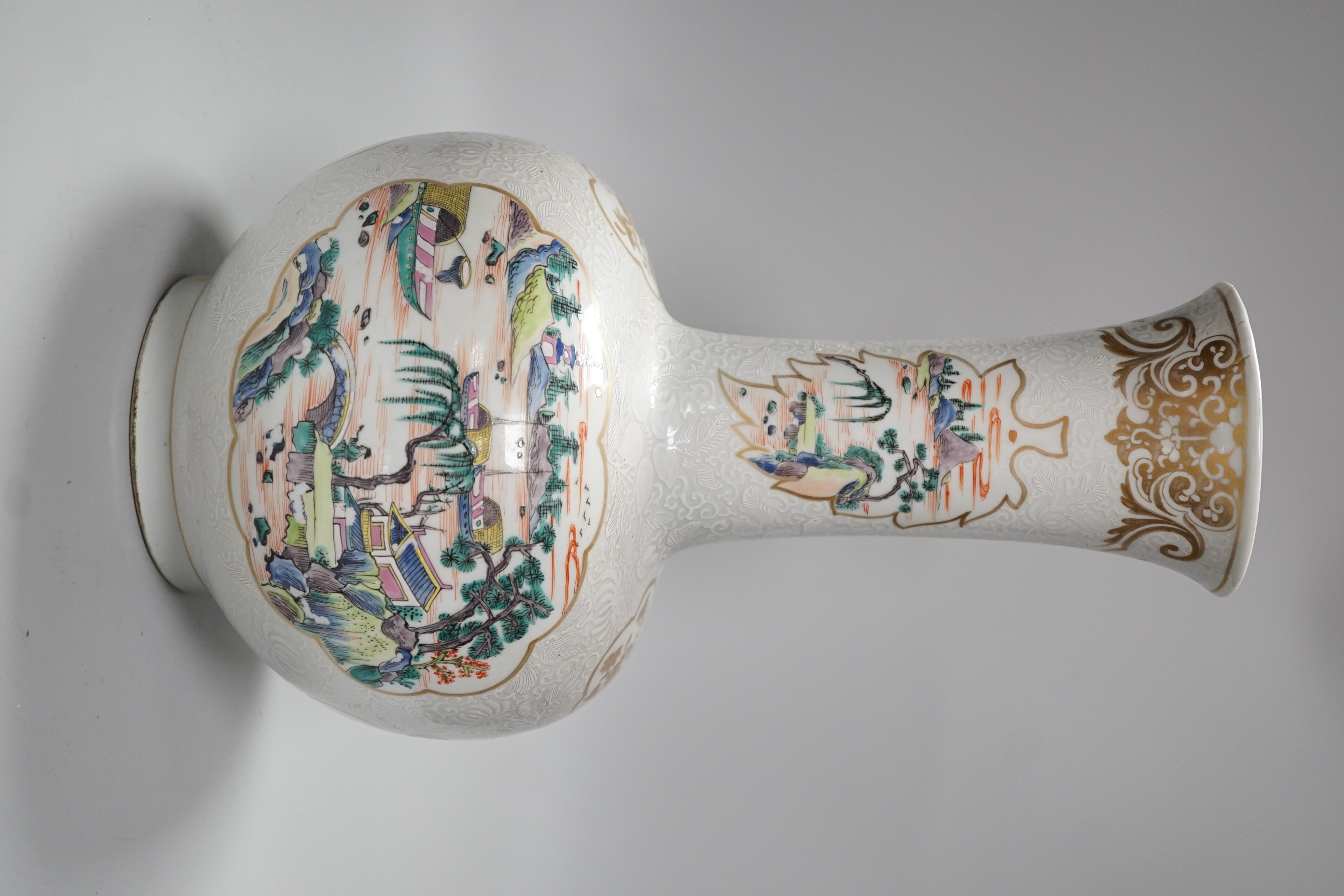 A Chinese enamelled porcelain bottle vase, 36cm, with bianco sopra bianco borders, base drilled